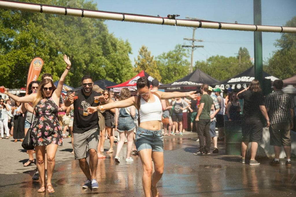 Vancouver Craft Beer Week Woman in Sprinkler