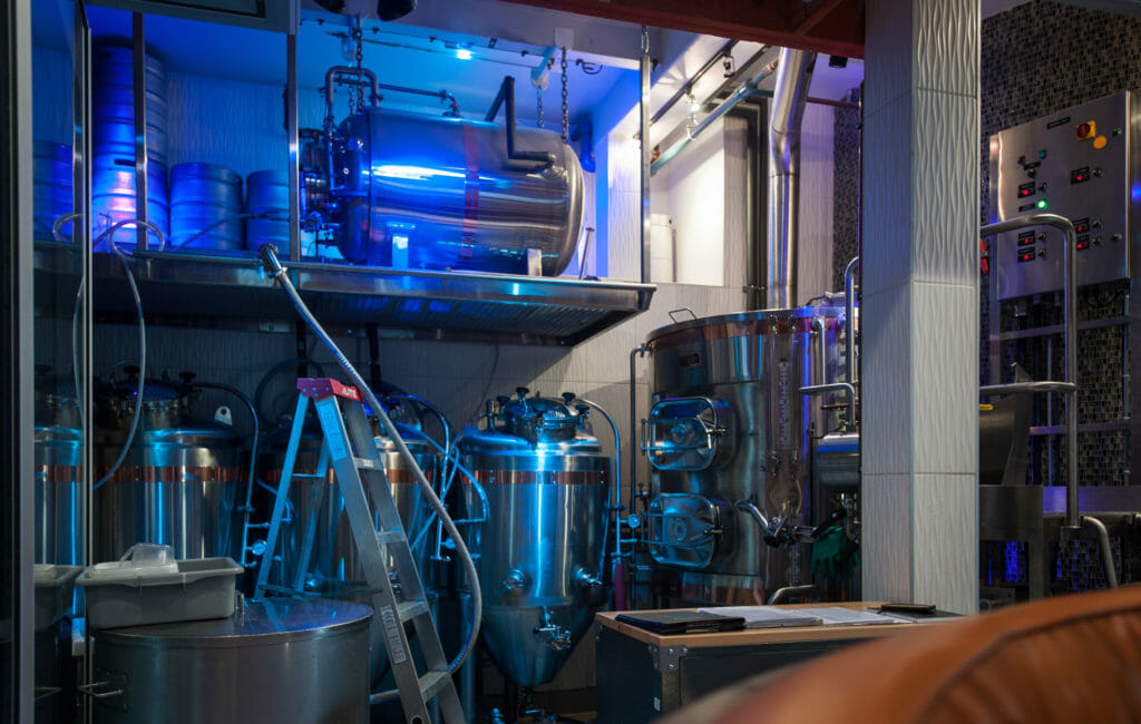 The Savoy Brewpub's strikingly illuminated brewhouse.