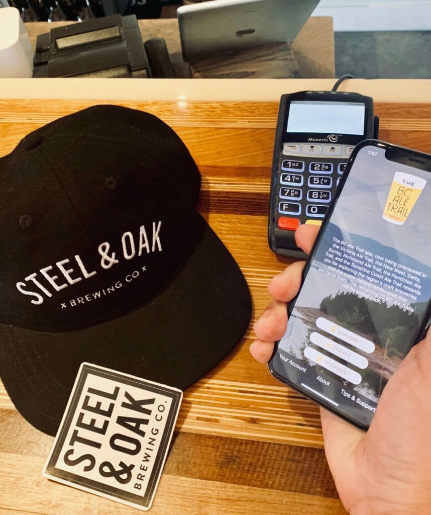 BC Ale Trail app in hand at Steel & Oak Brewing Co.