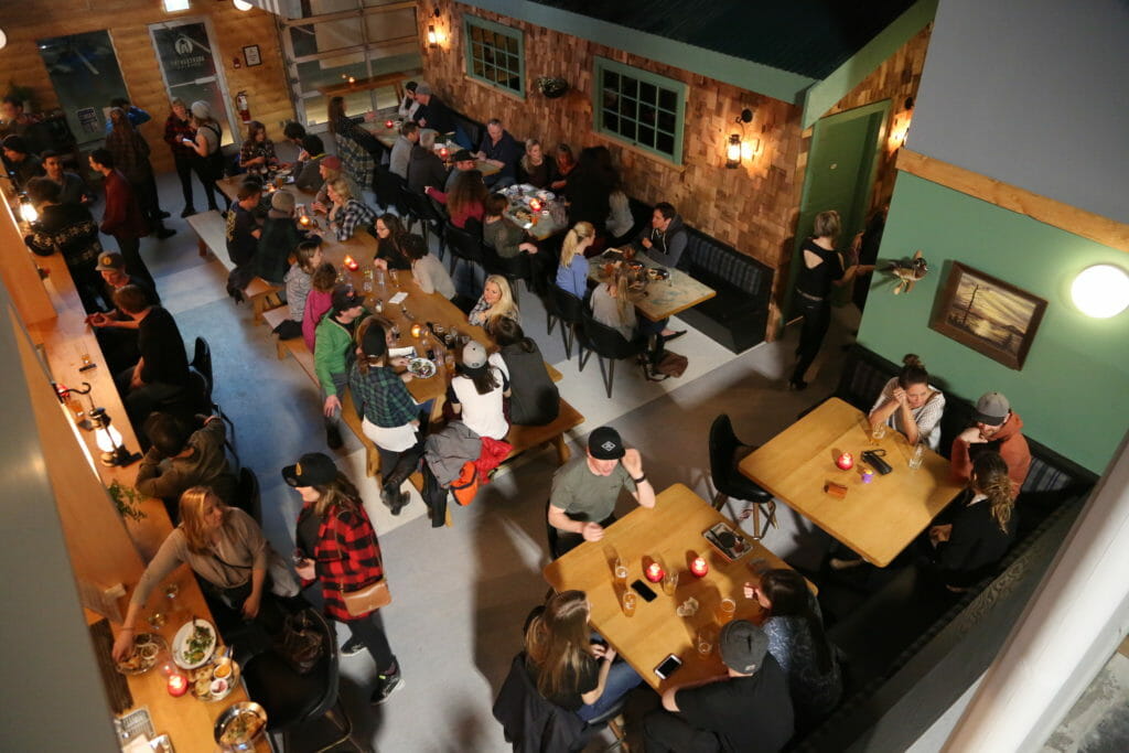 people enjoying beers at Backcountry Brewing in Squamish