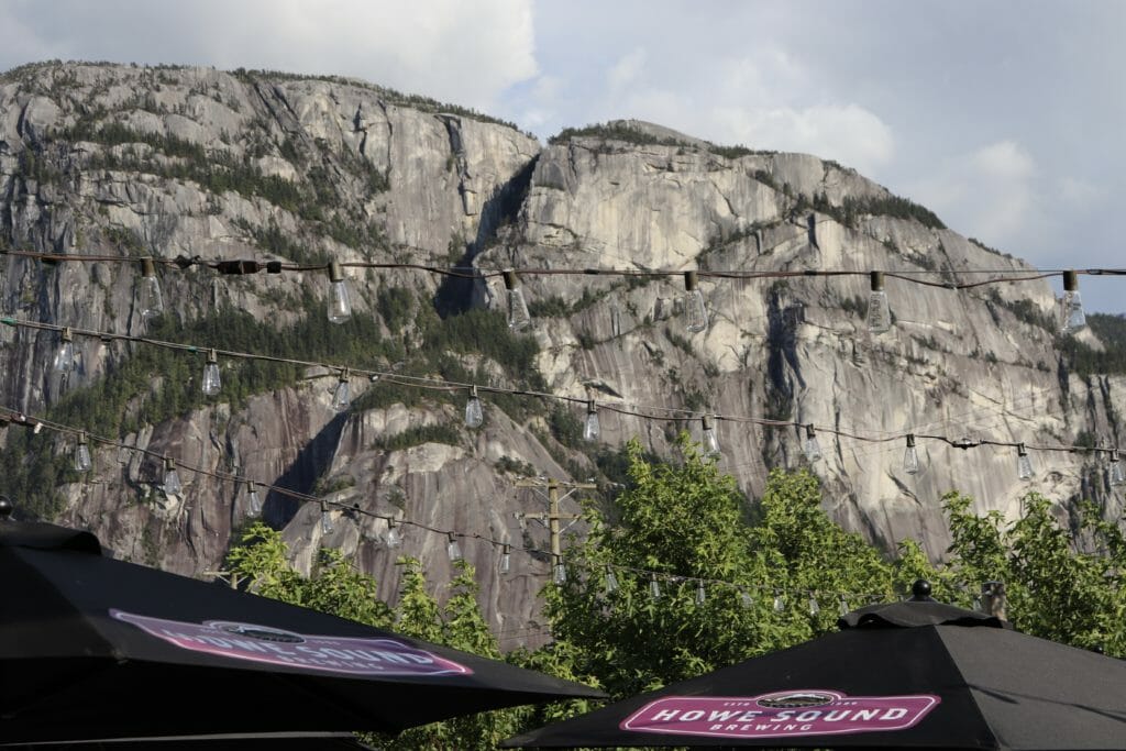 Stawamus Chief overlooking Howe Sound Brewing's patio in Squamish