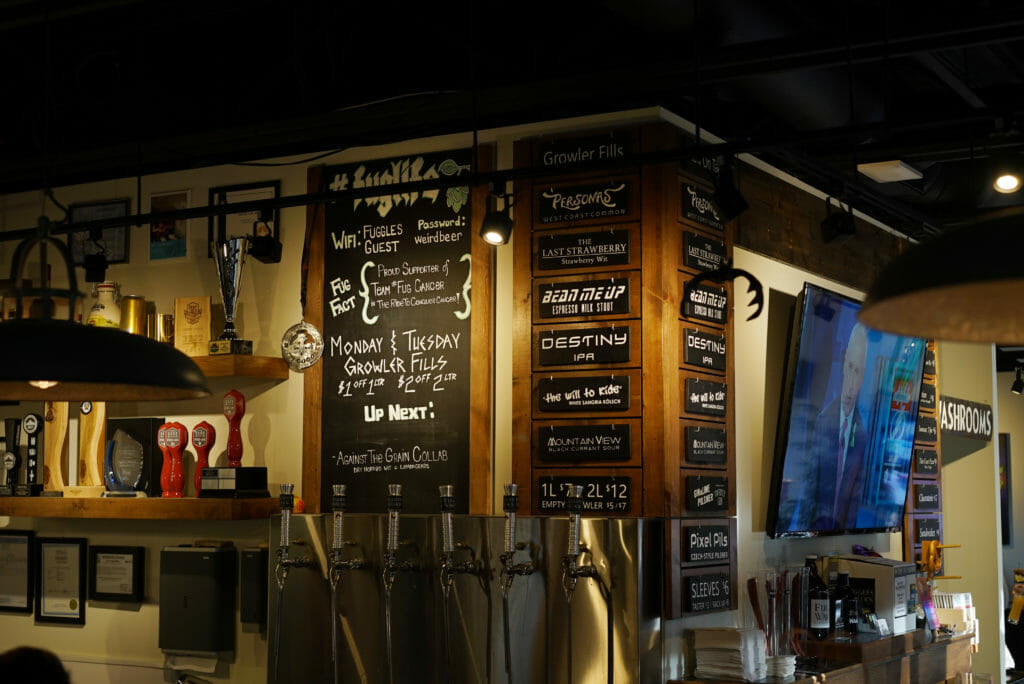 image of Fuggles & Warlock Craftworks interior with beer list and bar