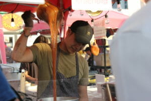 image of Chef Aaron Lee stirring sauce for his Korean braised chicken drumsticks