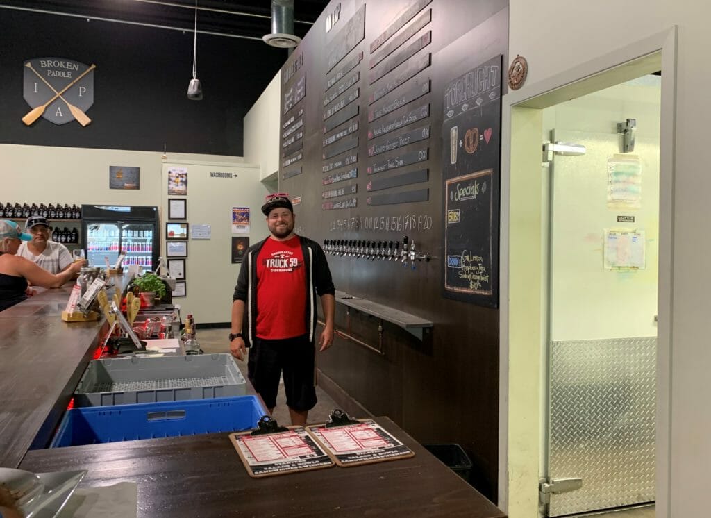 image of Torchlight Brewing's owner in the tasting room in Nelson, BC