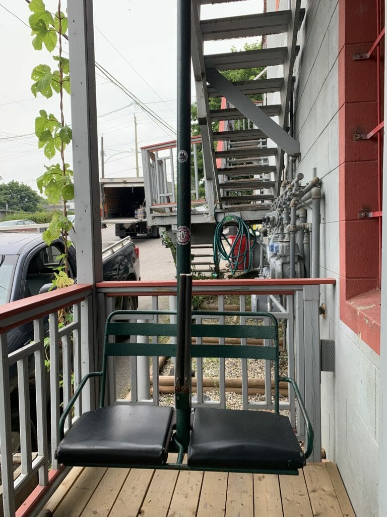 image of chairlift seat outside Nelson Brewing Company