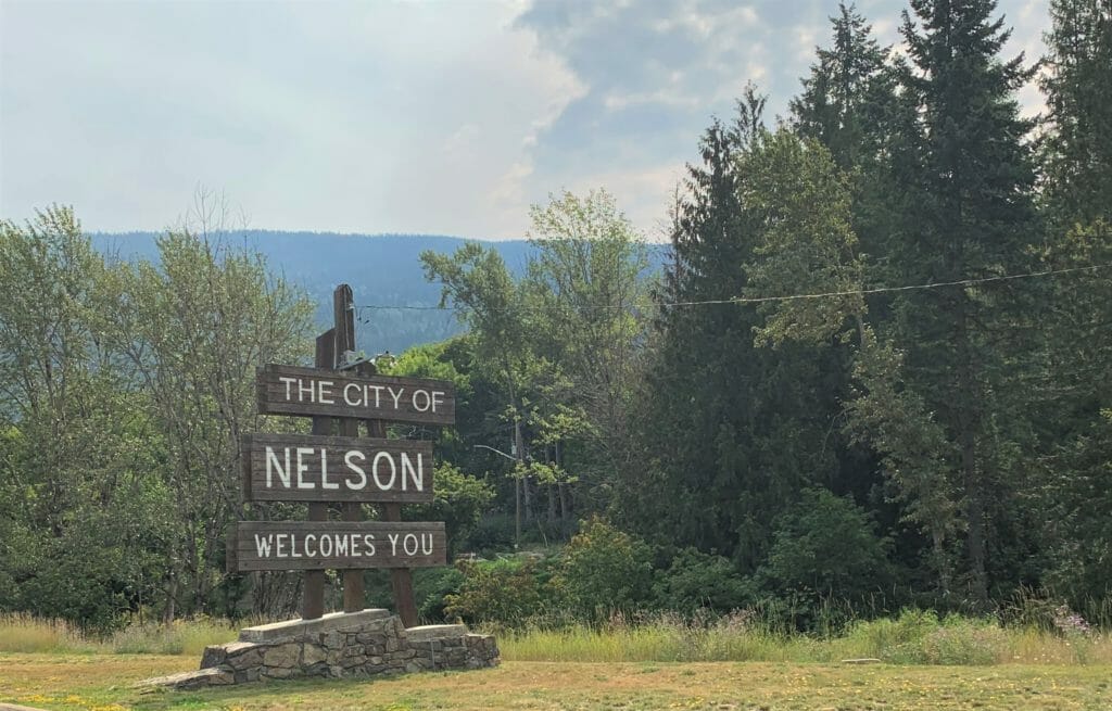 entrance sign for Nelson, BC says The City of Nelson Welcomes You