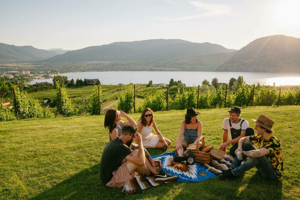 people enjoying a sunny picnic on the Penticton Ale Trail