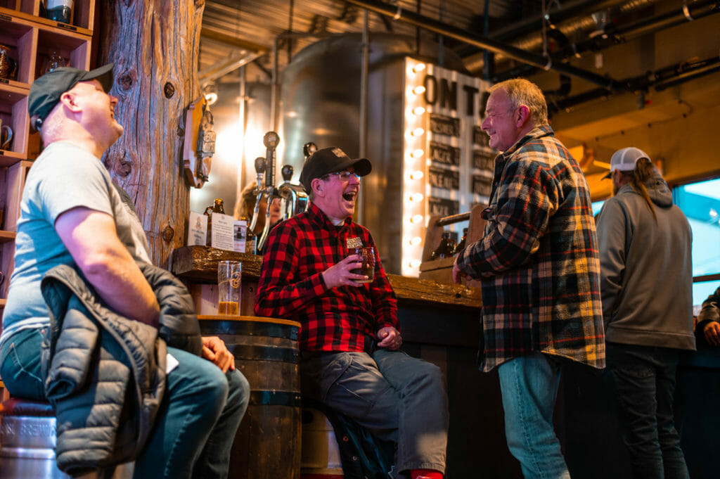 image of four men enjoying craft beer at Sherwood Mountain Brewhouse in Terrace on the Northern BC Ale Trail