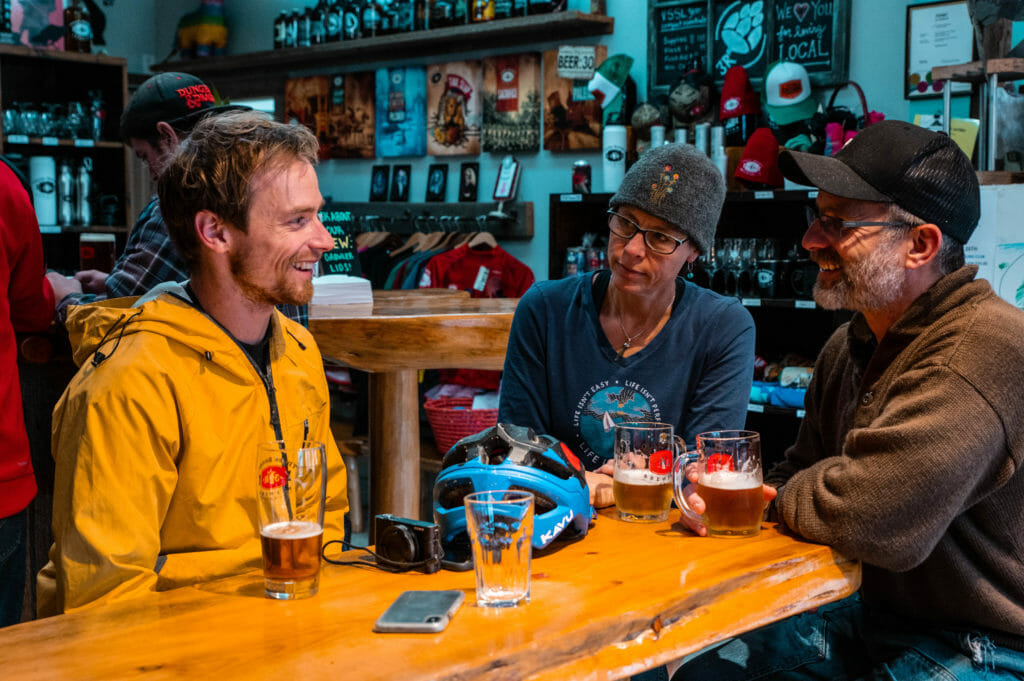 image of Mark Matthews talking to Michael and partner at Three Ranges Brewing Company in Valemount, BC