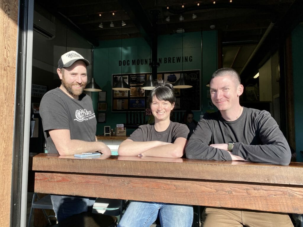 photo of Aaron, podcast host, with Andy Richards and Robin Miles, owners of Dog Mountain Brewing in Port Alberni