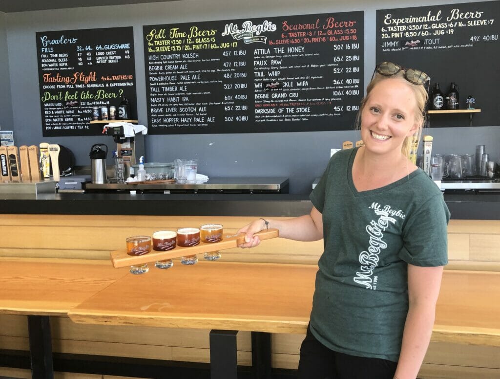 Cassandra with a flight in the Mt. Begbie taproom