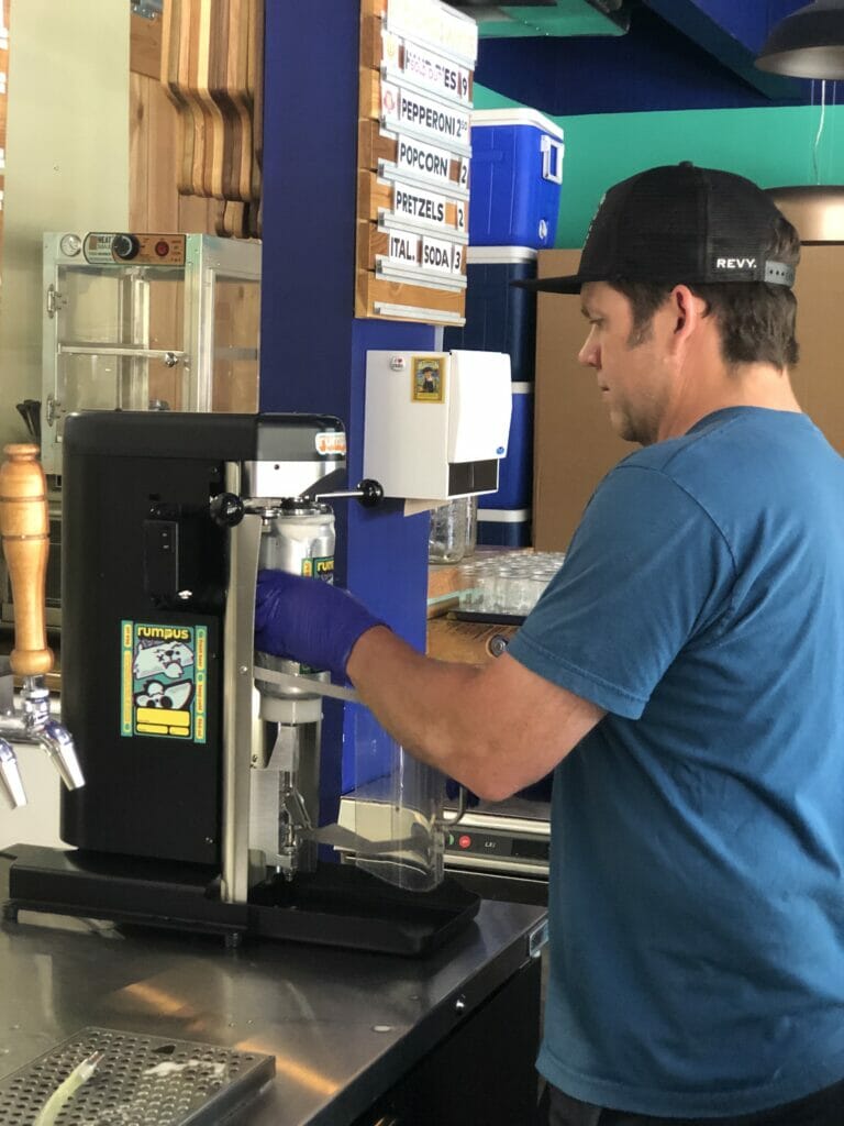 Fred filling a crowler at Rumpus Beer Co. on the BC Ale Trail