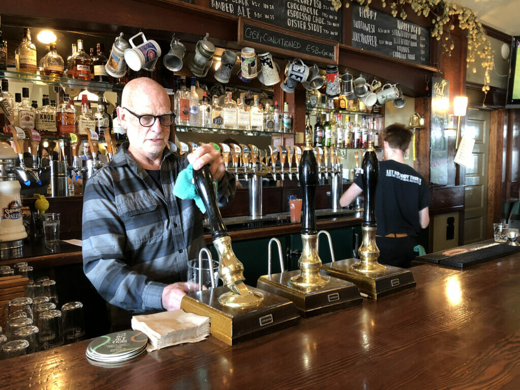 Paul Mitchell drawing a pint of English style beer at Spinnakers Brewpub in Victoria on the BC Ale Trail