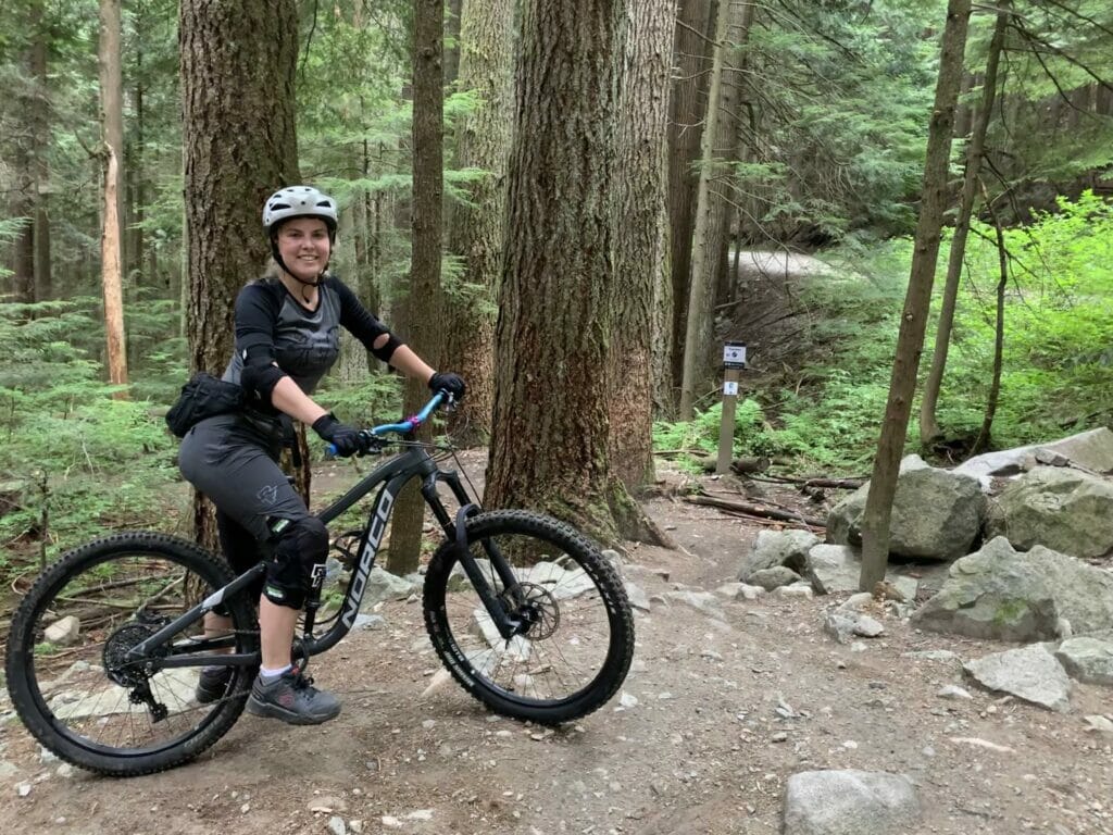 Ashley Brooks from Four Winds Brewing on her mountain bike