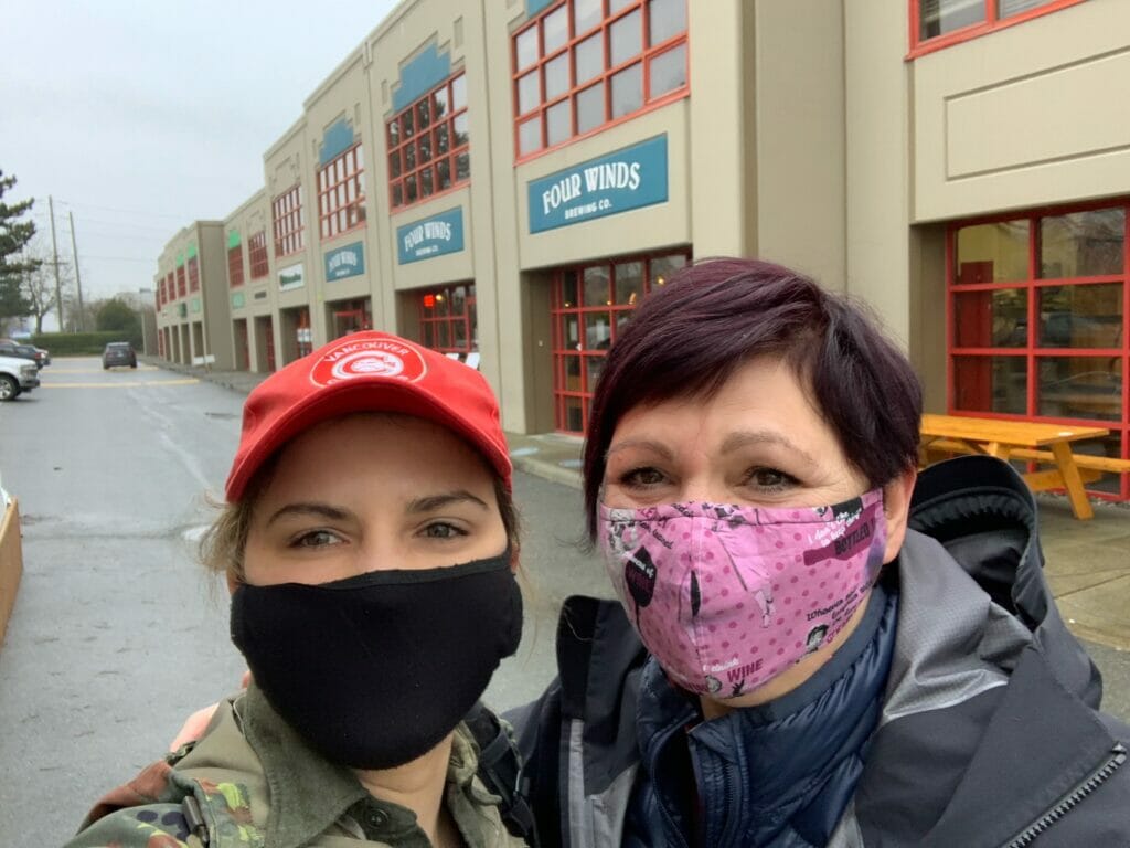 Ashley Brooks in front of Four Winds Brewing with her mom