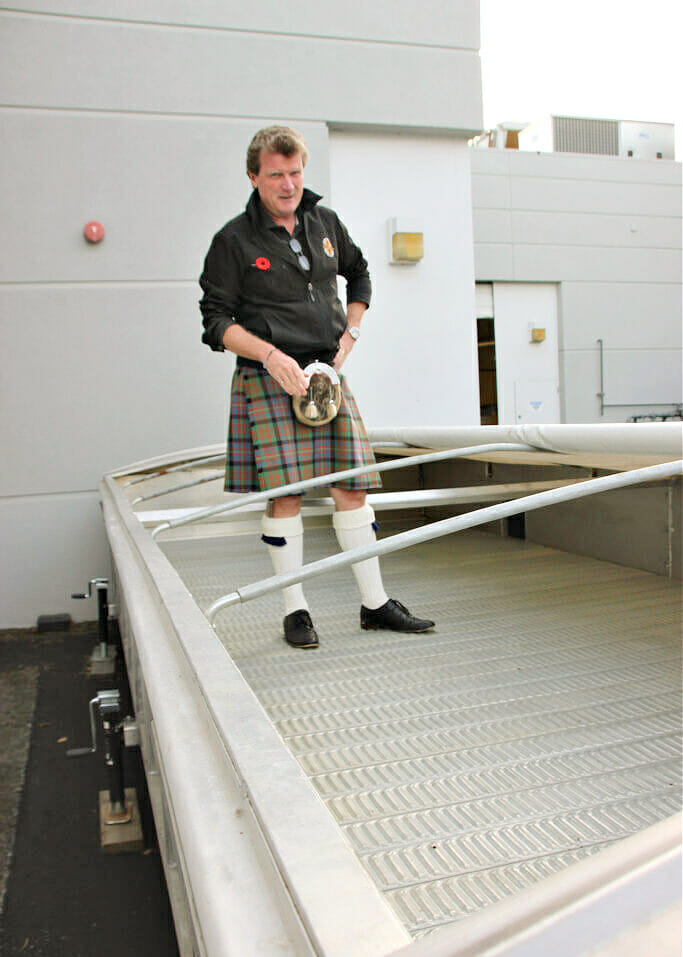 Caledonians-Graeme-Macaloney-standing-inside-his-peat-soaker-smoker