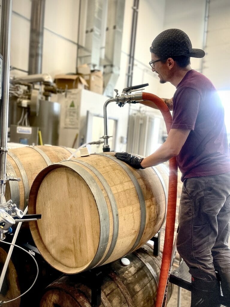 Miguel Molina from Boardwalk Brewing working on a barrel aged beer called Tart of Funk