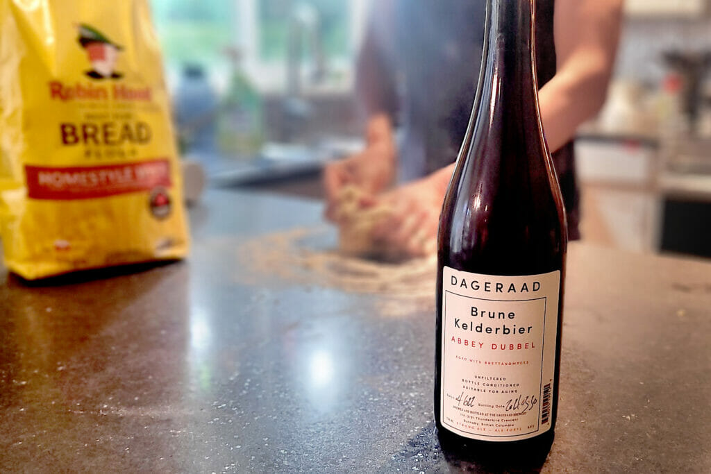 A bottle of Dageraad Brewing beer while baking bread