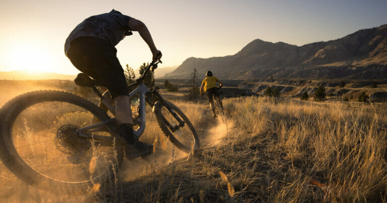 Jordan Hodder and Erin Holloway riding the Coyote Crossing trail in Kamloops, BC