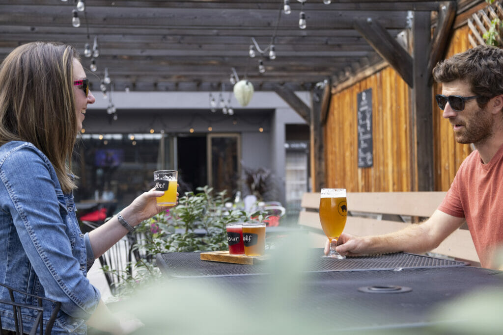 Enjoying beers on the patio at Noble Pig Brewhouse in Kamloops, BC