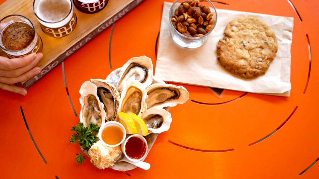 Oysters and snacks with a flight of beer at Whistle Buoy Brewing in Victoria, BC