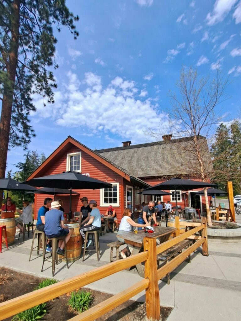 The sunny outdoor patio at Barn Owl Brewing in Kelowna, BC