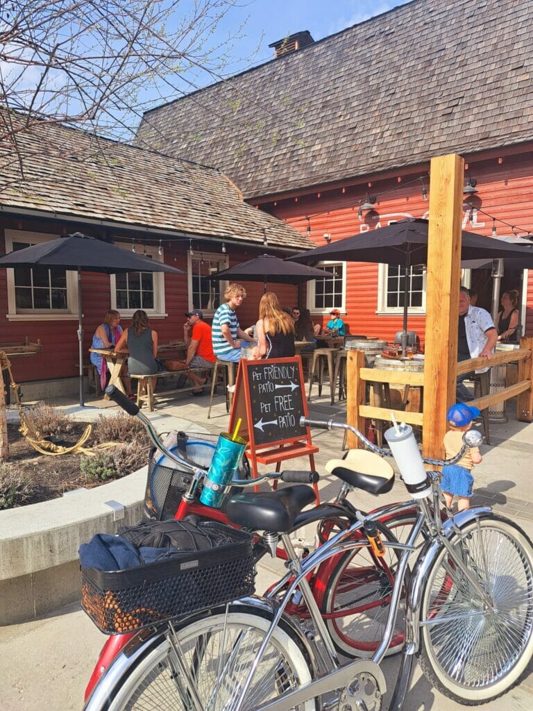 The sunny outdoor patio at Barn Owl Brewing in Kelowna, BC