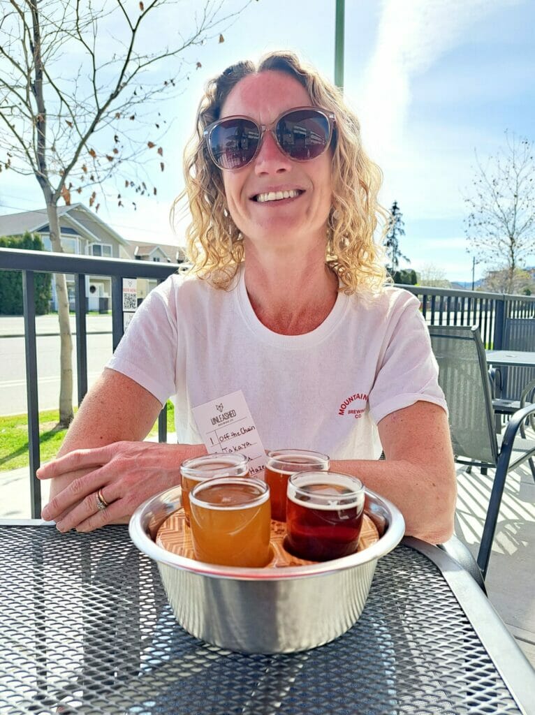 Hannah with her flight of beer at Unleashed Brewing, Kelowna, BC