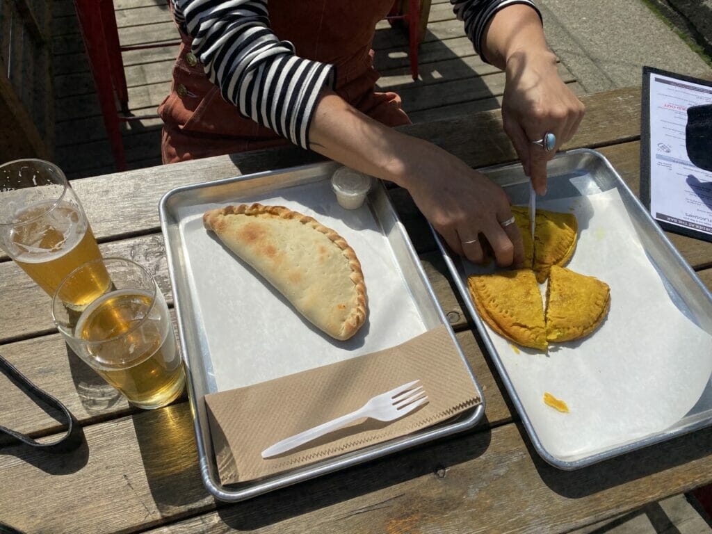 a calzone and Jamaican Patties at Steel & Oak Brewing in New Westminster, BC