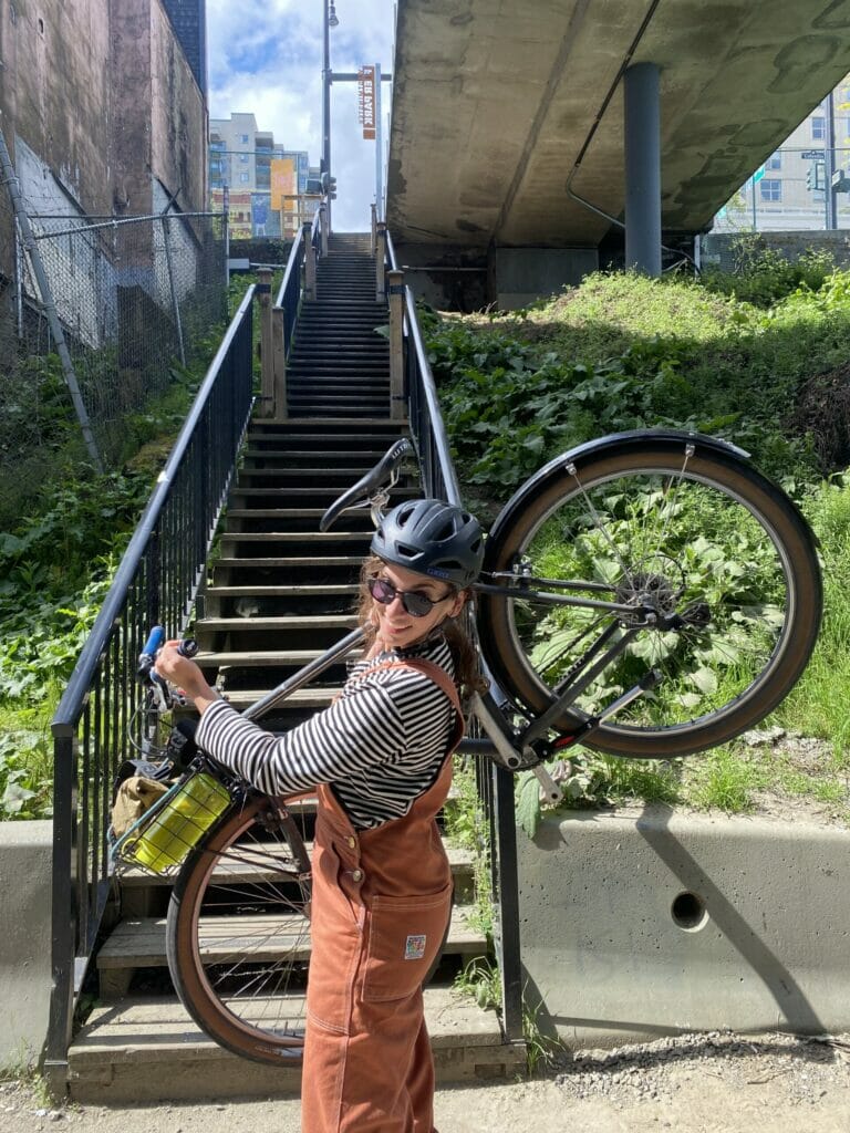 Carrying bikes up a set of stairs in New Westminster, BC