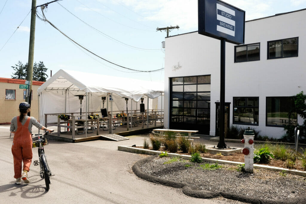 A cyclist arriving at Studio Brewing in Burnaby, BC