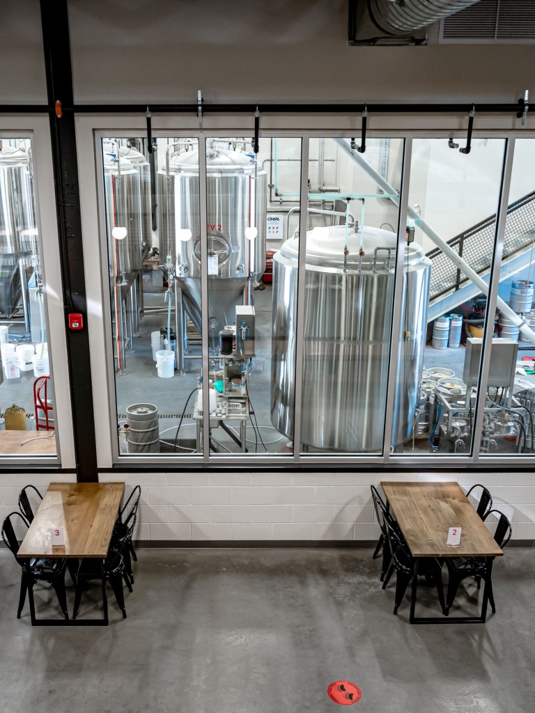 The tasting room with view of the brewery at Mountainview Brewing